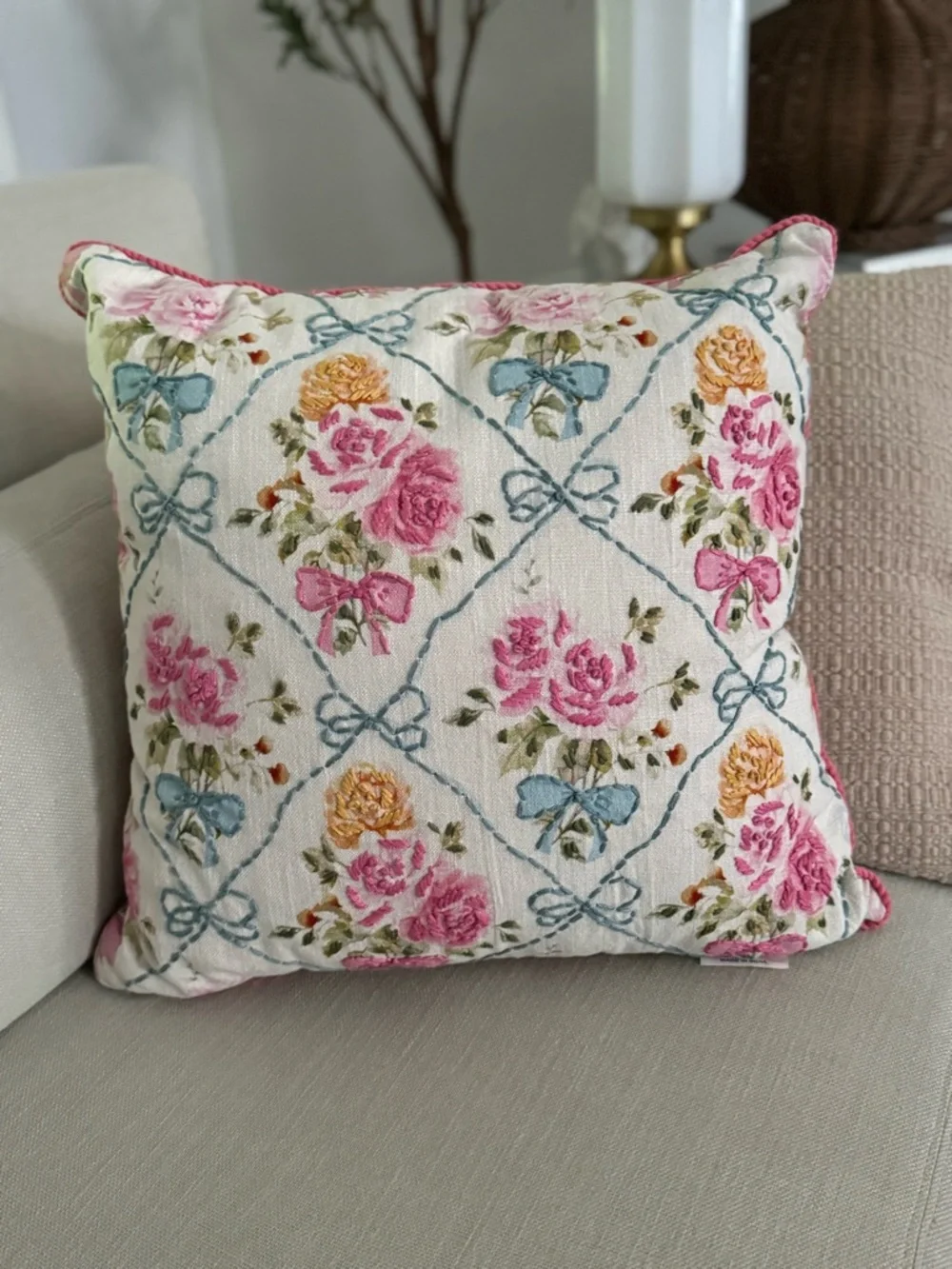 20” x 20” throw pillow features a trellis pattern with embroidered